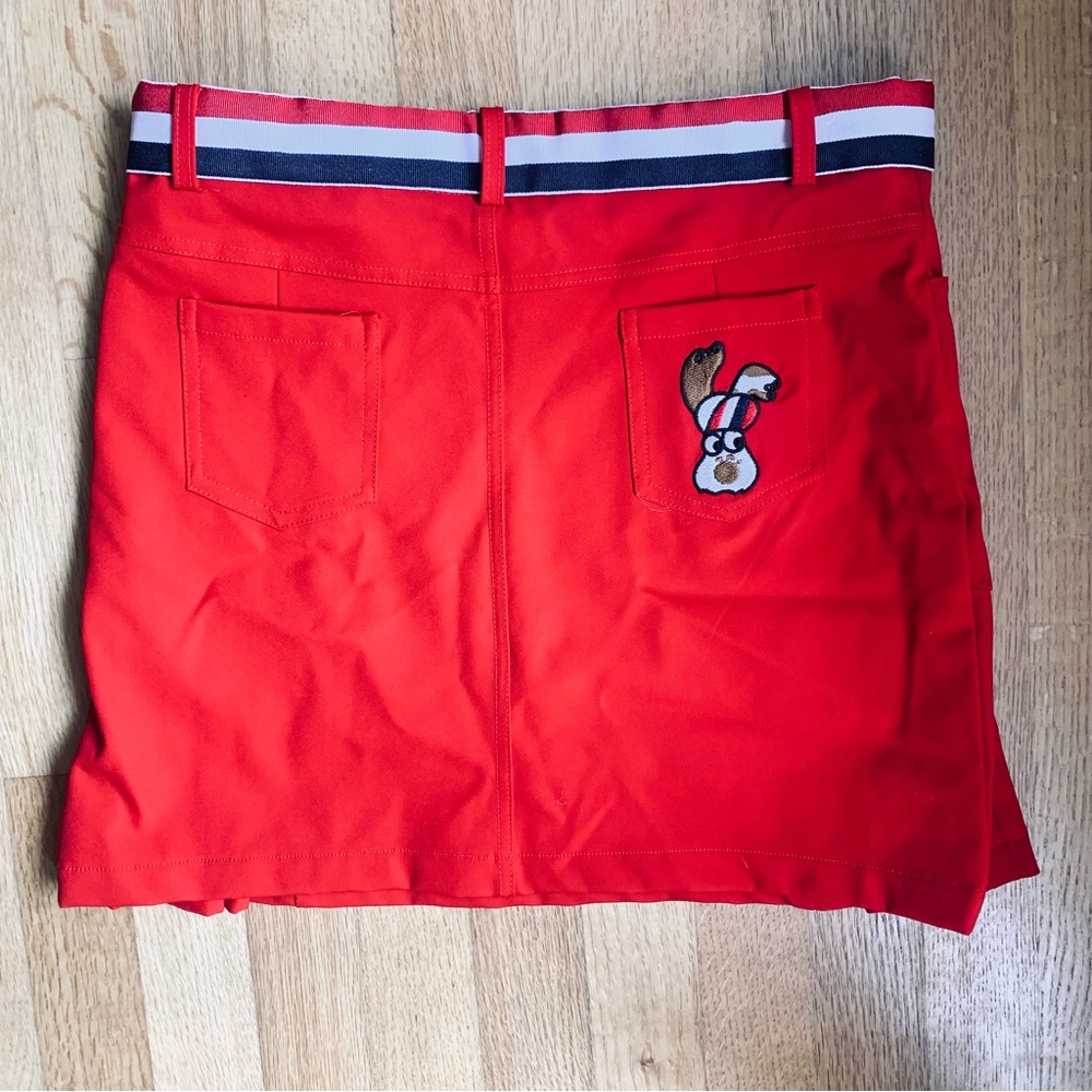 Red golf skort with puppy design